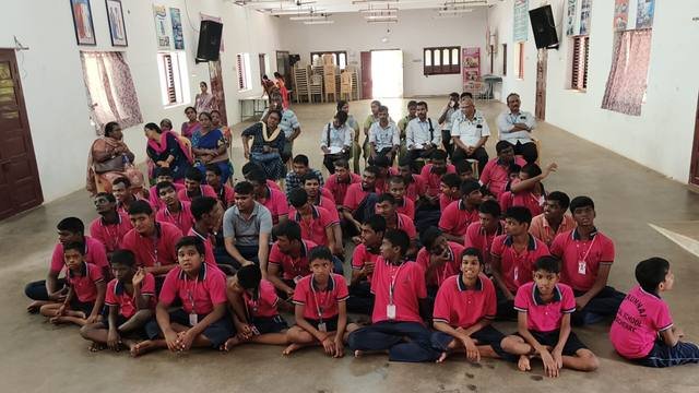 Children and staff gathered in the school hall