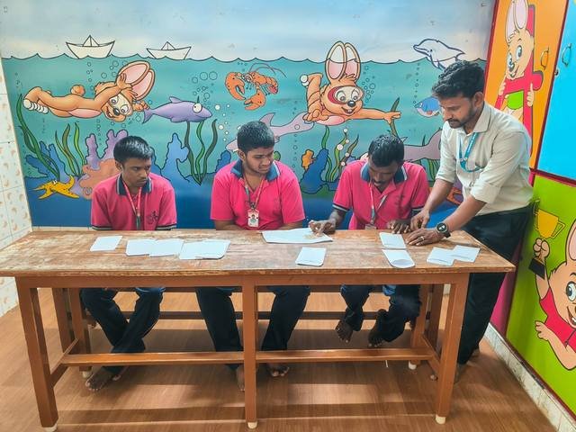Children at a table activity in a painted classroom